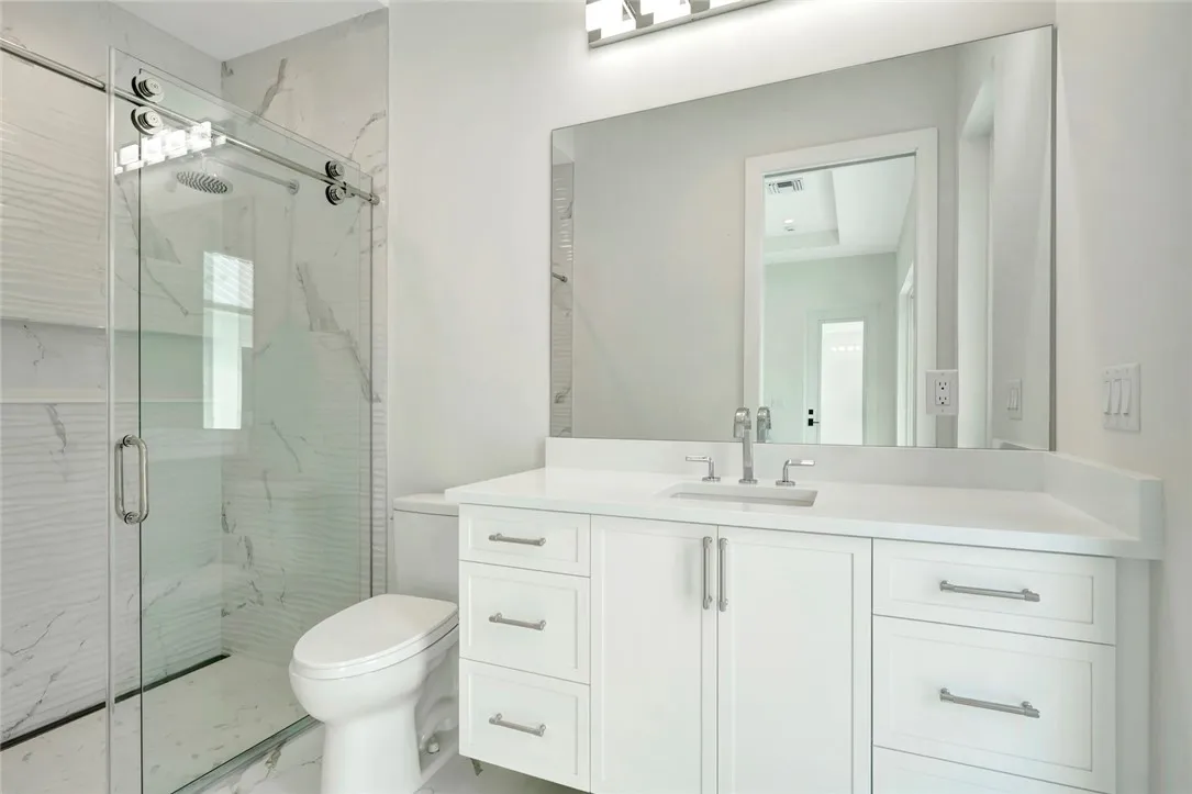 Walk-in shower and shaker vanity